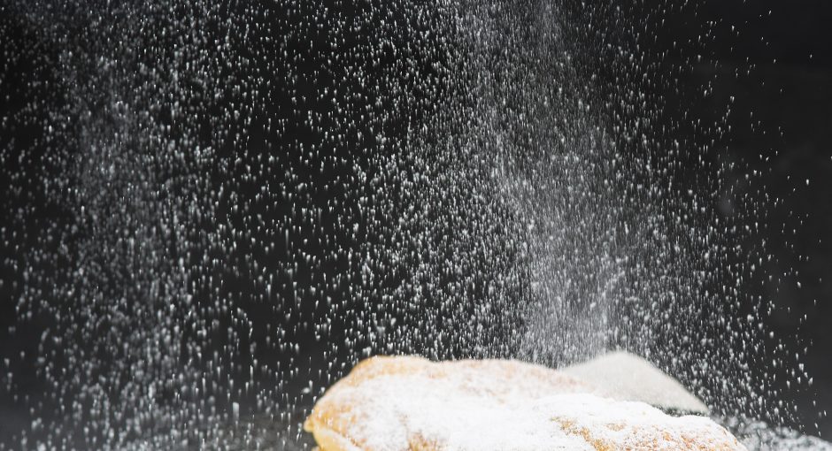 Sprinkling Powdered Sugar On Cakes